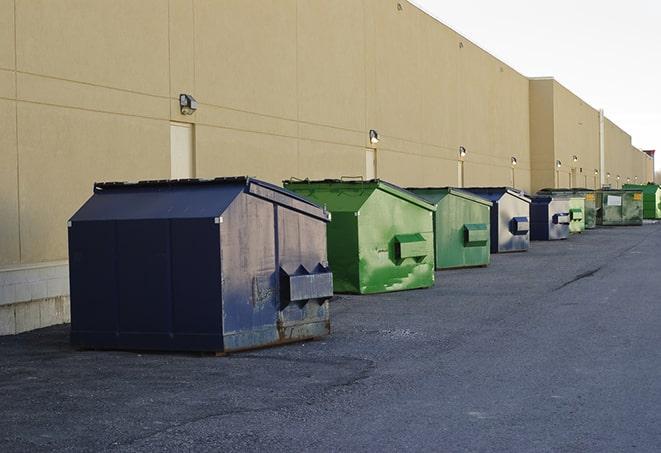 an assortment of sturdy and reliable waste containers near a construction area in Batson TX